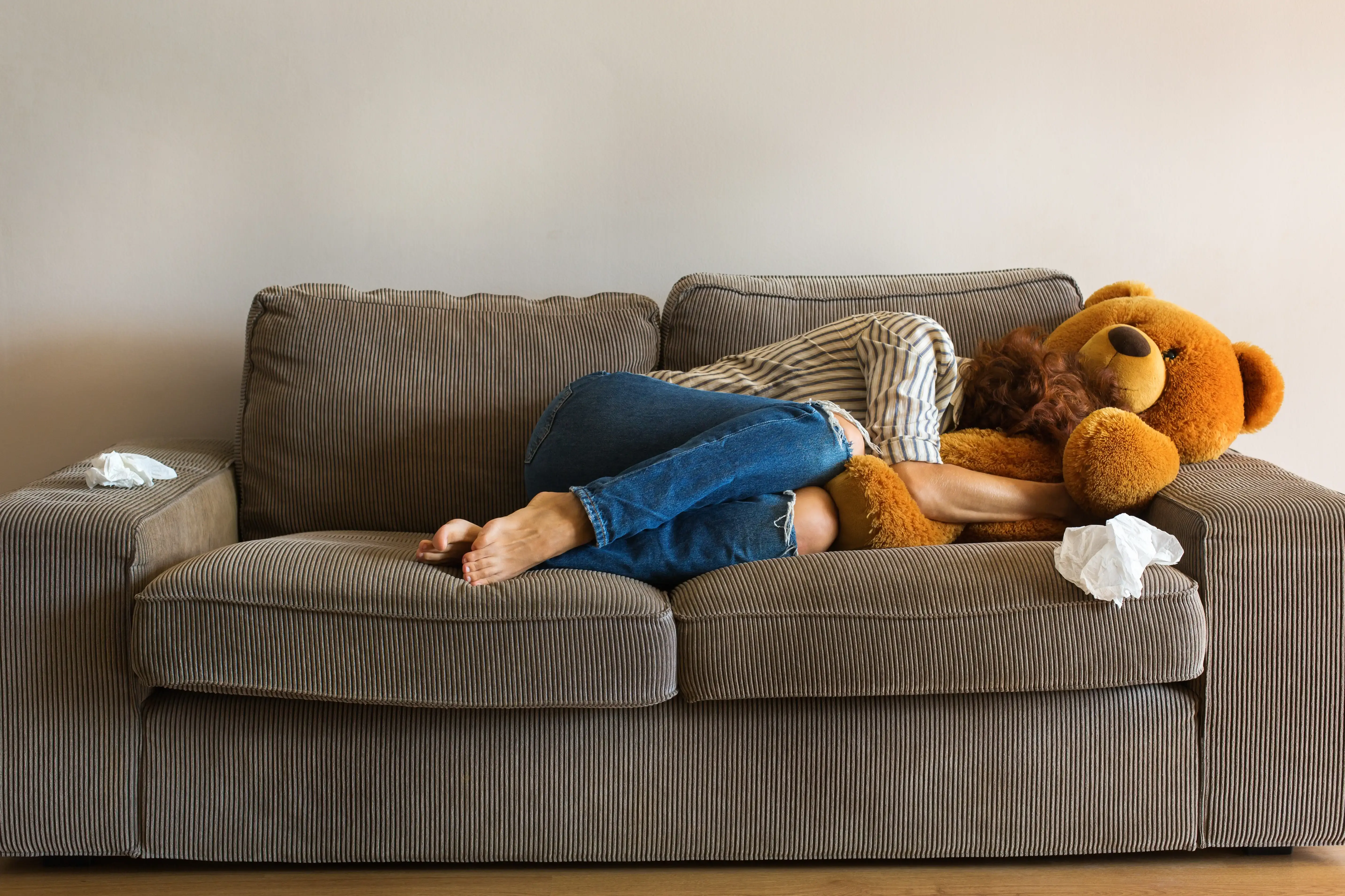 depressed-young-woman-crying-on-the-couch-stress-2024-10-18-06-45-15-utc