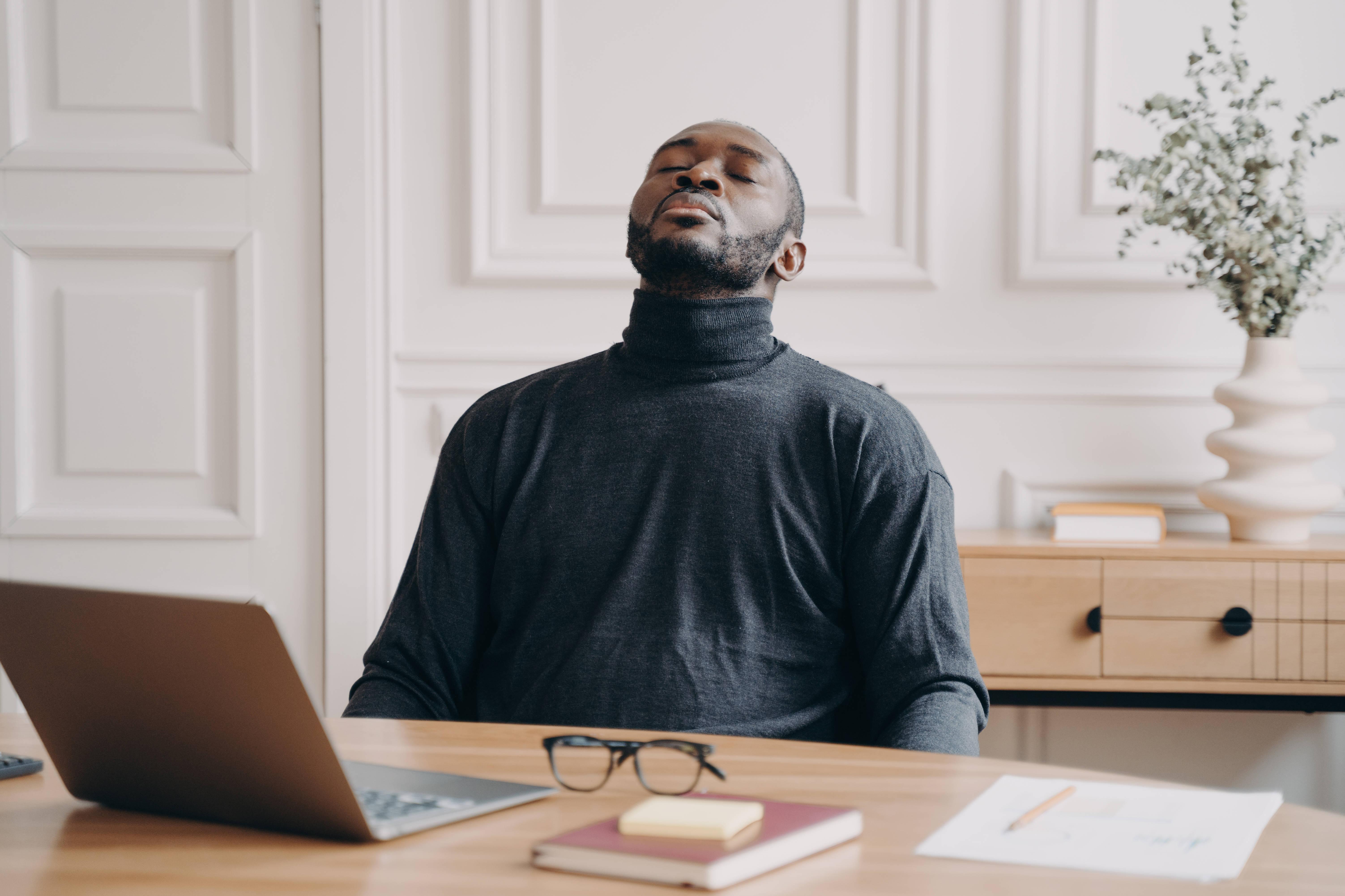 exhausted-home-office-employee-african-american-ma-2025-03-08-21-56-00-utc