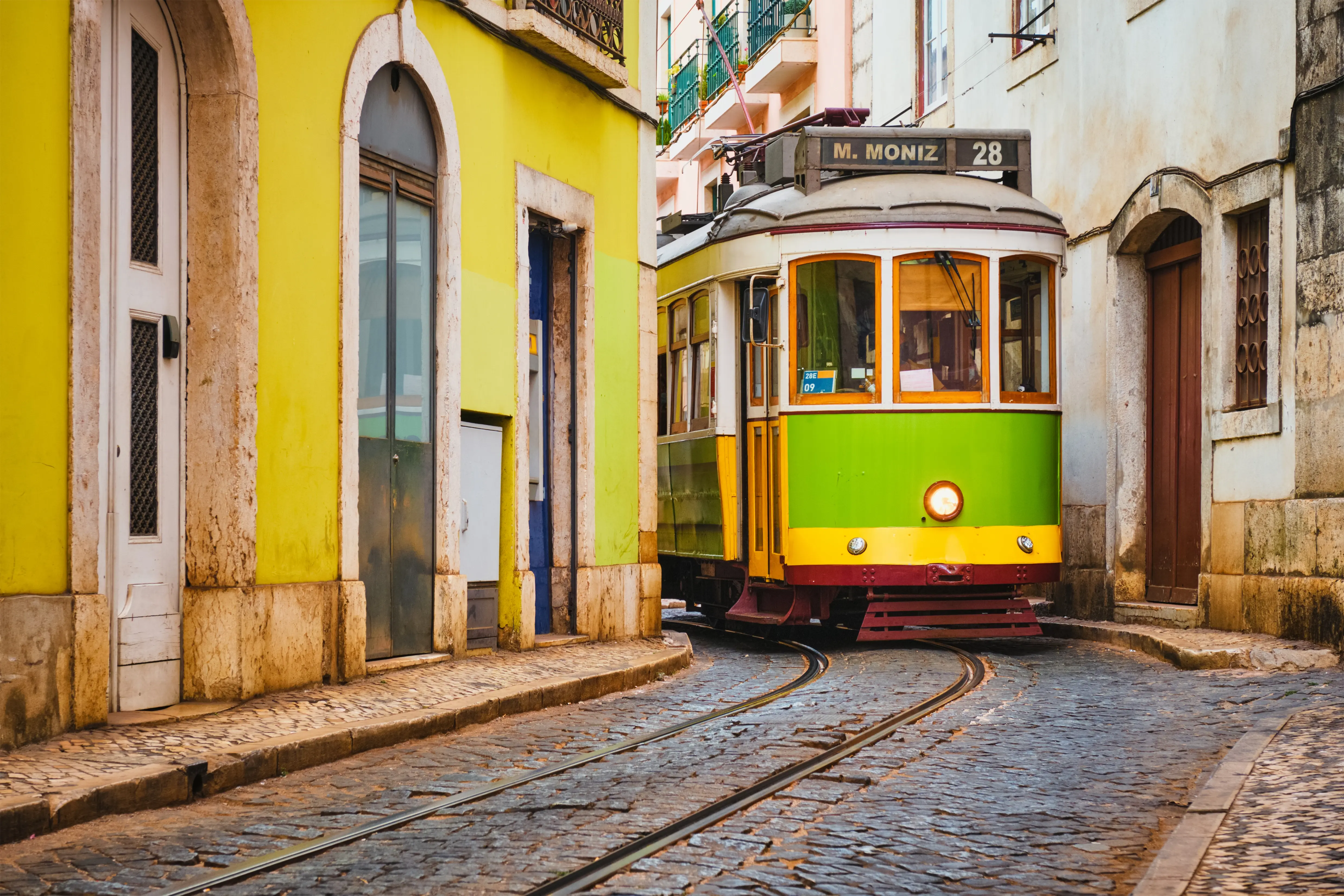 famous-vintage-yellow-tram-28-in-the-narrow-street-2024-10-16-20-07-09-utc