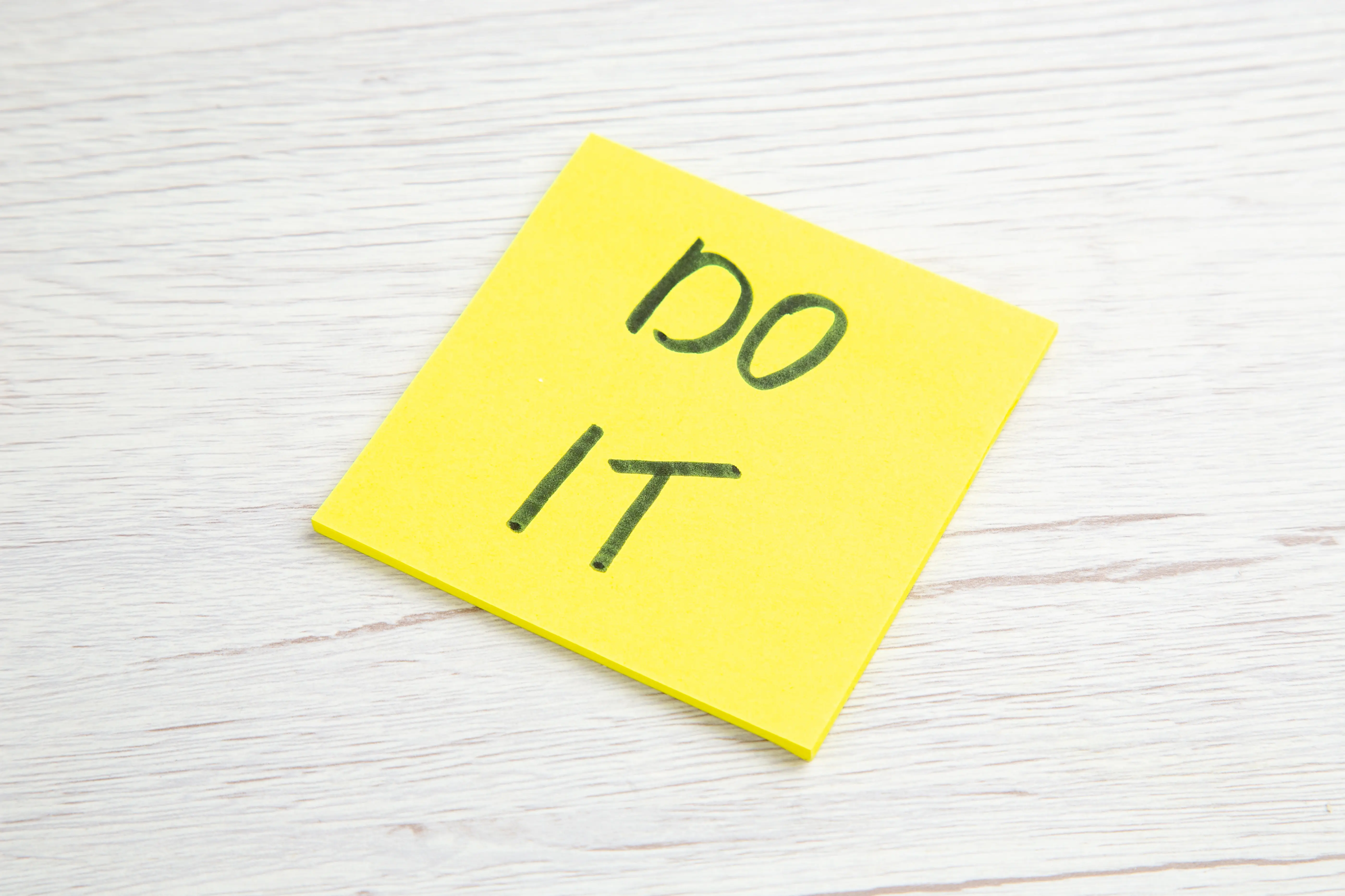 front-view-do-it-note-on-yellow-sticker-on-white-b-2025-02-10-08-45-33-utc