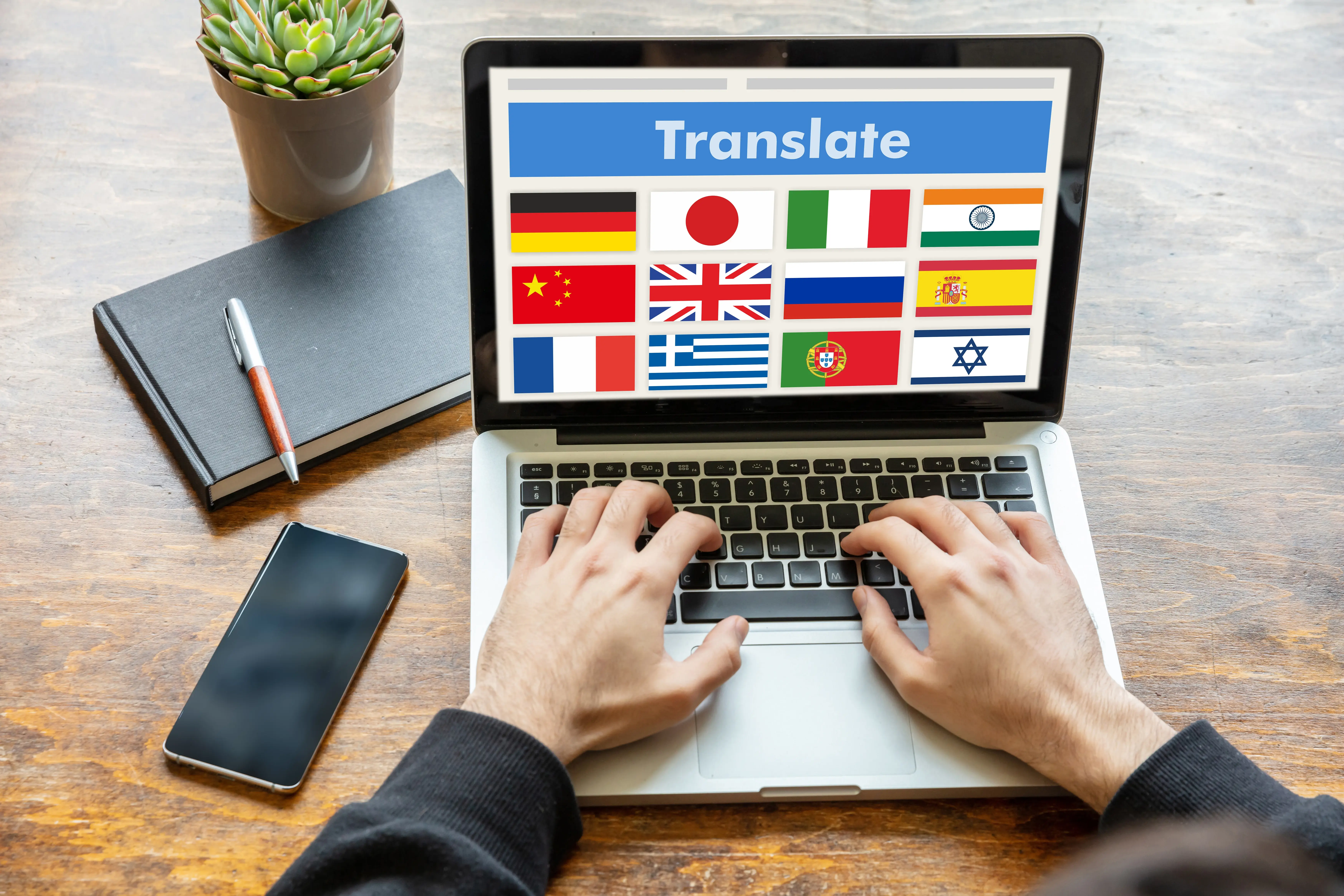 man-working-on-a-laptop-with-the-word-translate-on-2024-12-07-18-53-33-utc