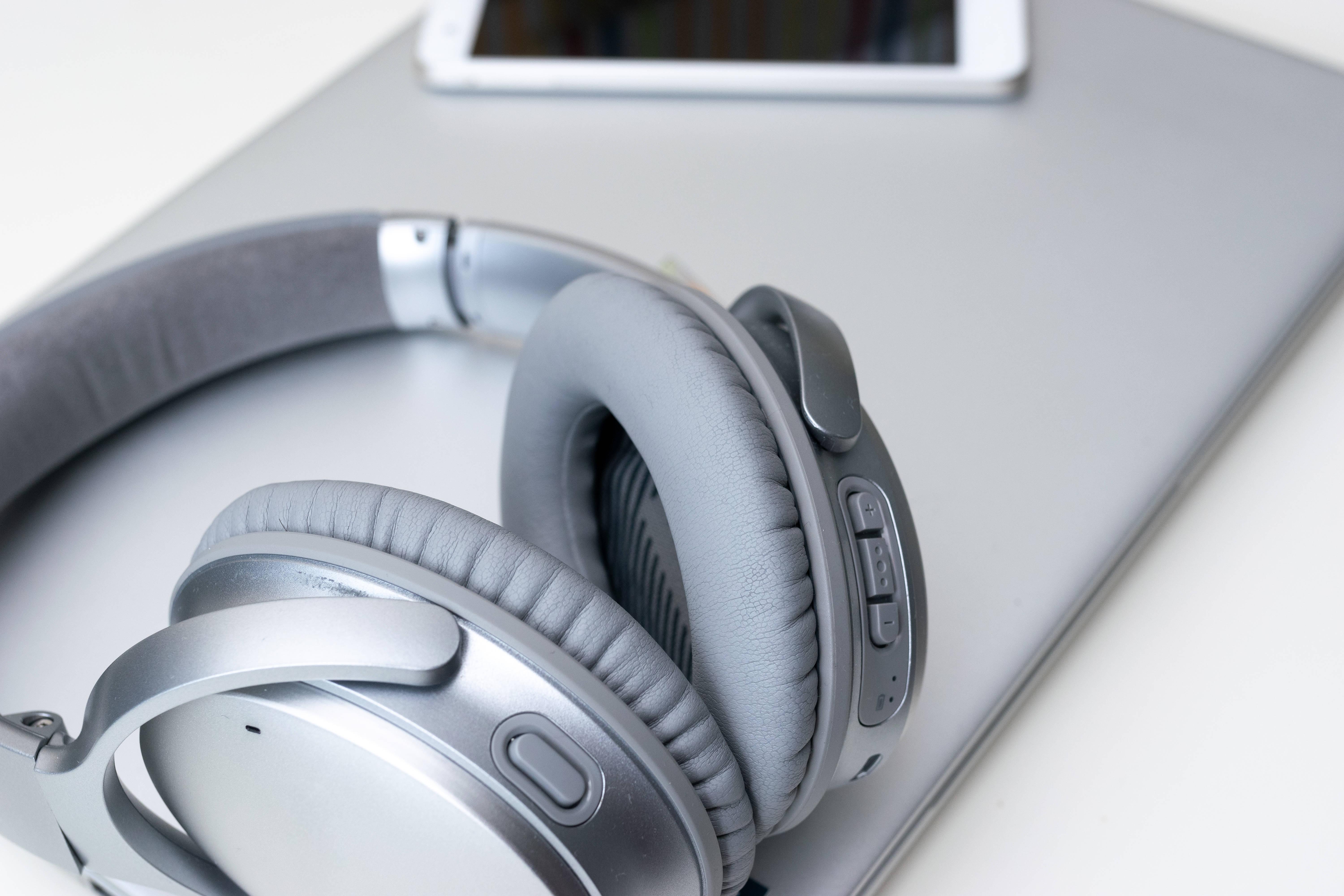 modern-smartphone-and-gray-headphones-on-a-gray-la-2025-02-02-21-10-58-utc
