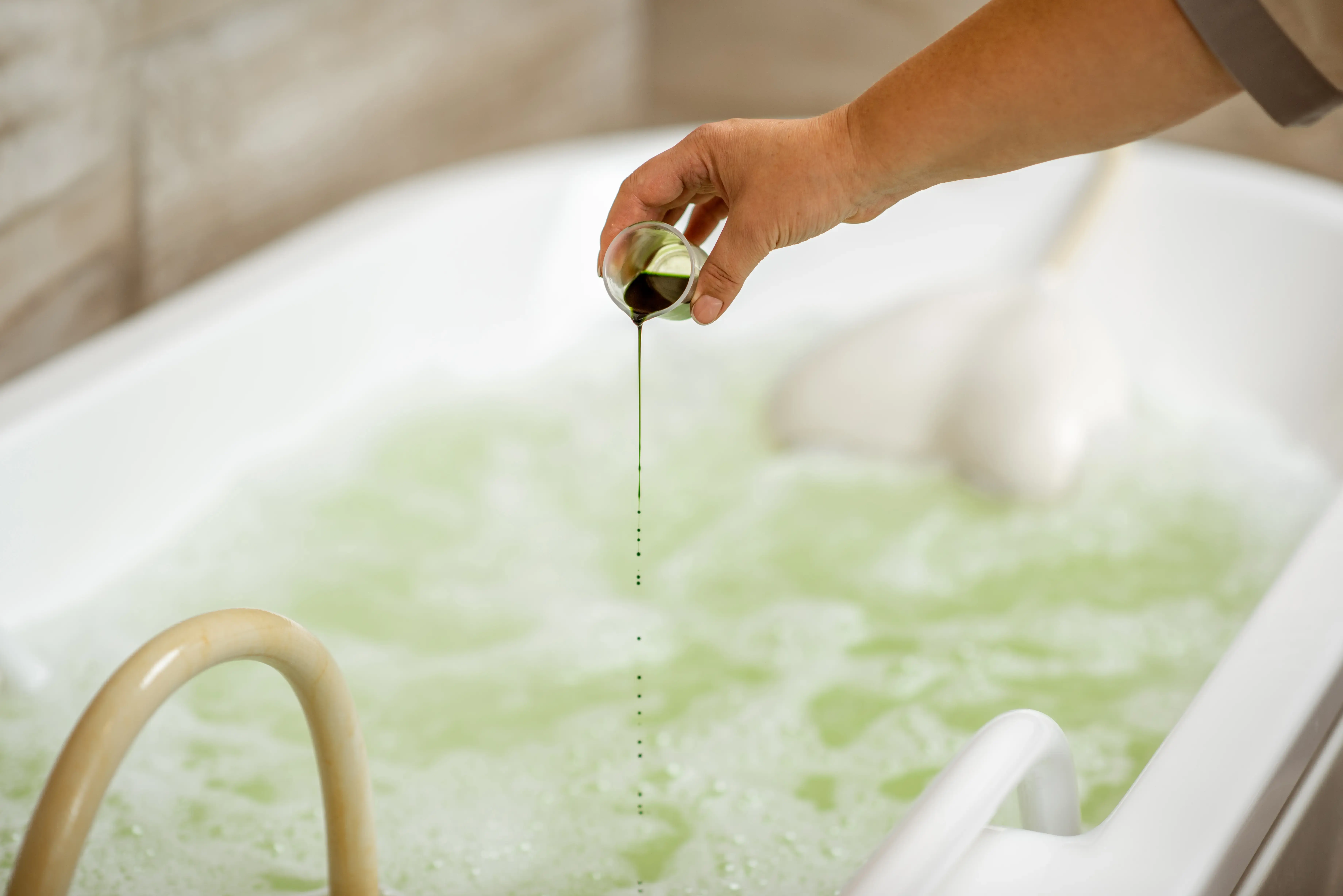 pouring-special-ingredient-for-hydromassage-2025-03-13-10-38-44-utc