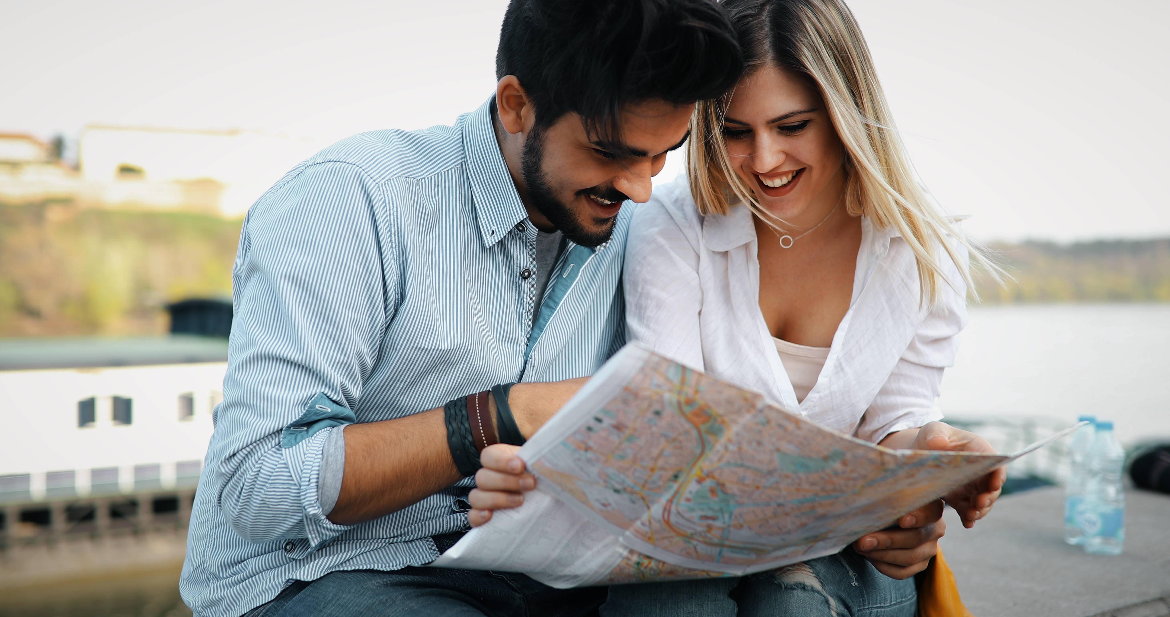 smiling-couple-in-love-traveling-with-a-map-outdoo-2025-03-13-22-58-37-utc