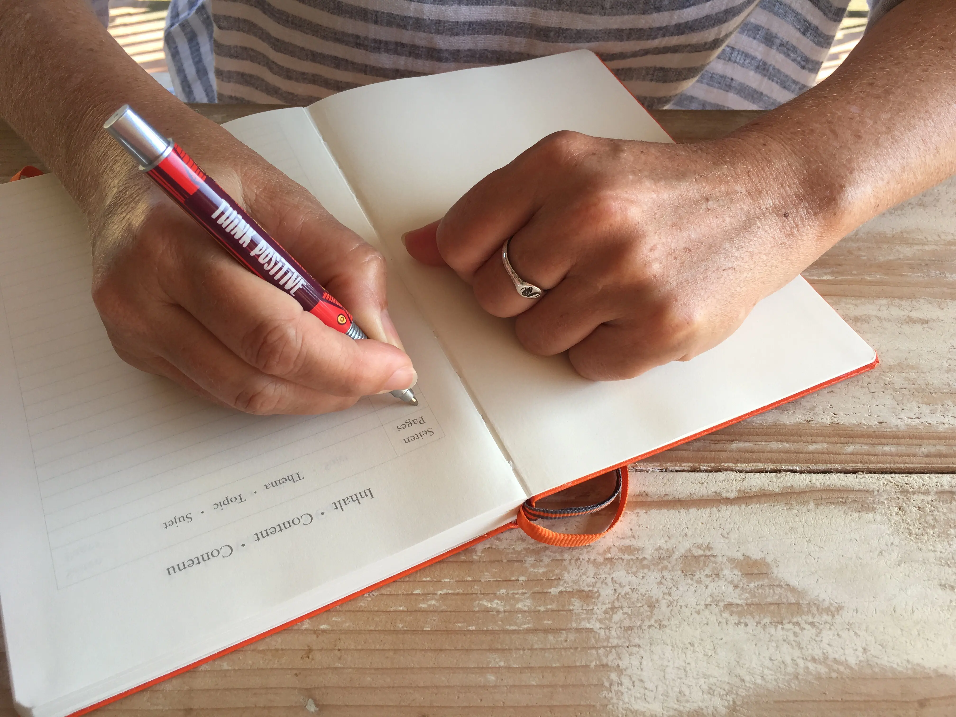 woman-about-to-start-writing-a-new-bullet-journal-2025-03-09-09-07-55-utc